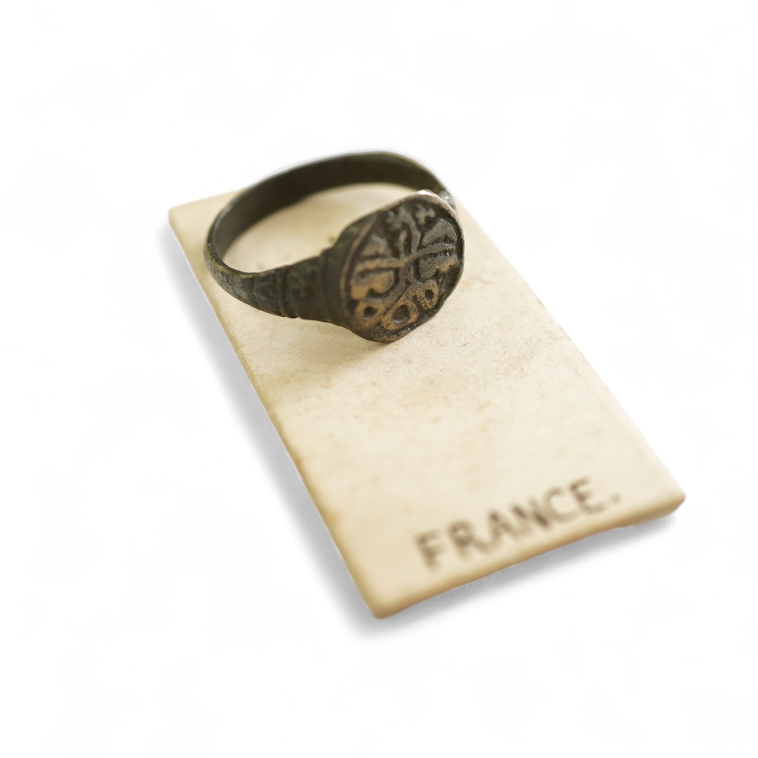 A sentimental signet ring, France, circa 16th century, the circular panel depicting two hearts tied in a true lover's knot, size R1/2, labelled 2244, Provenance: formerly in the collection of Dame Joan Evans (1893-1977)